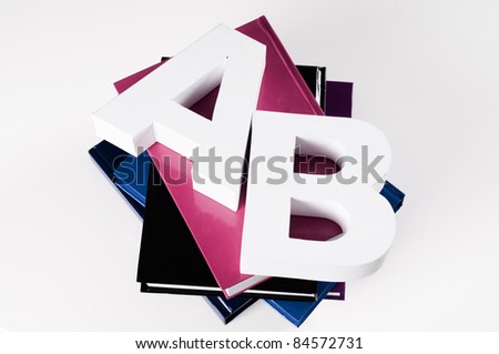 pile of books with letters