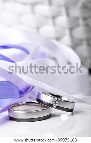 stock photo wedding rings with purple lace