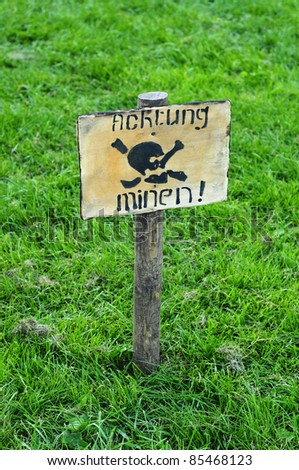 warning sign with German text Watch out mines