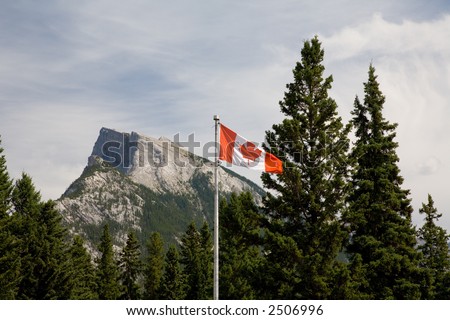 Mt Rundle in the Canadian Rockies with Canadian Flag