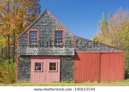 Old Wood shingle rustic shed in fall Maine.