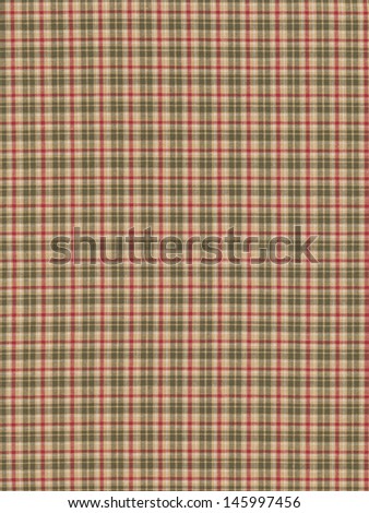 Red white green and tan plaid fabric swatch textile background.