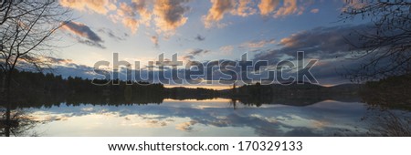 Colorful Sunset panorama of Flying Pond Vienna Maine.