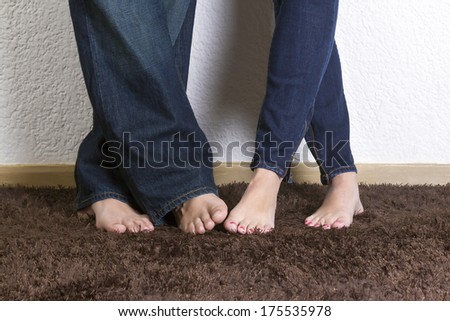 Couple in jeans and barefeet