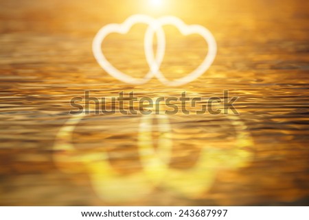 Abstract white heart on the water surface.