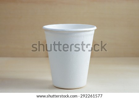 Paper food container on wood background