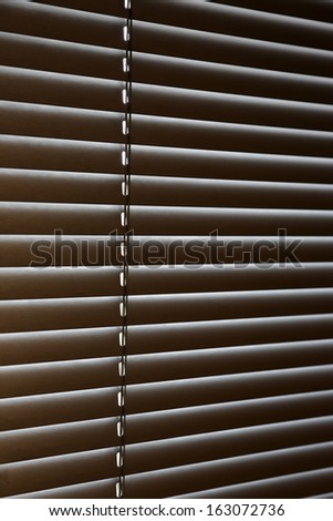 closed horizontal jalousie on the window