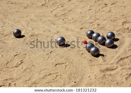 balls for the game of petanque on the sand