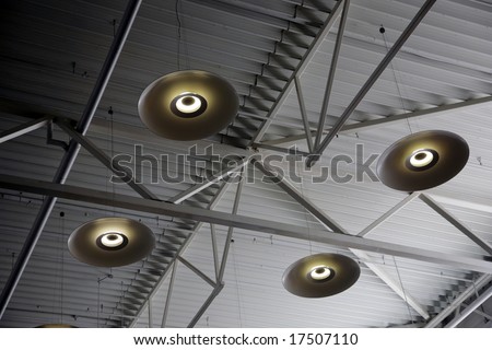 Electric fixtures under a metal ceiling of a building