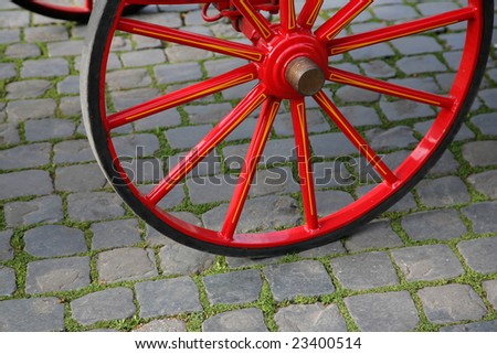 Wheel of a walking carriage on a stone blocks