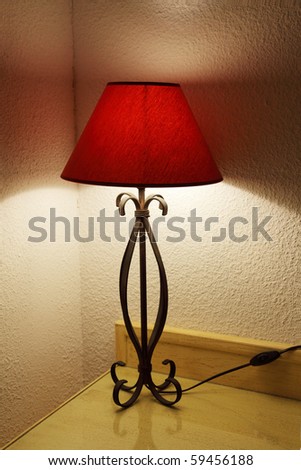 Lamp with the lamp shade on a table in a room