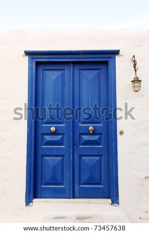 Old dark blue door in a wall