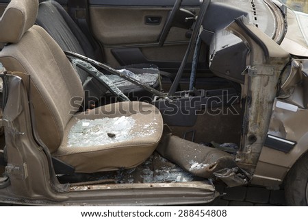 car completely destroyed with broken glass after the traffic accident