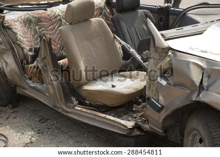 car completely destroyed with broken glass after the traffic accident