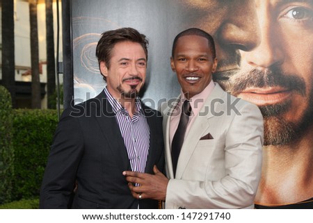 Robert Downey Jr (Black suite)  & Jamie Foxx (light colored suite) arriving at the Soloist Premiere at Paramount Studios in Los Angeles,  California on April 20, 2009