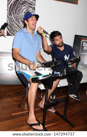 Zachary Levi & Joshua Gomez  at the Chuck Kickoff party presented by Guitar Hero Five Roosevelt Hotel Pool  Los Angeles,  CA October 10,  2009