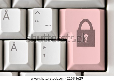 Close-up of a lock icon on a computer keyboard button.