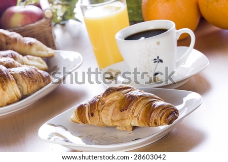 Breakfast concept with coffee, croissant and juice