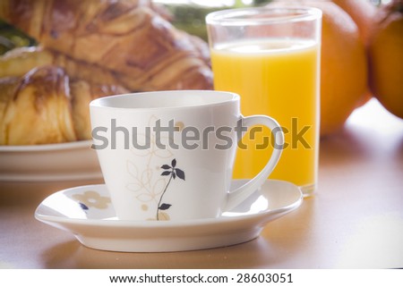 Breakfast concept with coffee, croissant and juice