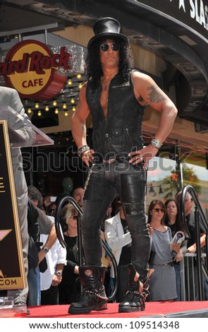 Rock guitarist Slash on Hollywood Blvd where he was honored with a star on the Hollywood Walk of Fame. July 10, 2012  Los Angeles, CA Picture: Paul Smith / Featureflash