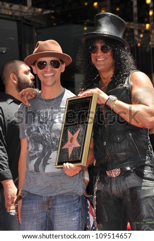 Rock guitarist Slash & actor Clifton Collins Jr on Hollywood Blvd where he was honored with a star on the Hollywood Walk of Fame. July 10, 2012  Los Angeles, CA Picture: Paul Smith / Featureflash