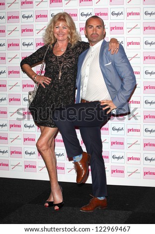 Debbie Moore and Louie Spence arriving for the Prima Comfort Fashion Awards 2012, At Evolution, Battersea Park, London. 13/09/2012 Picture by: Alexandra Glen