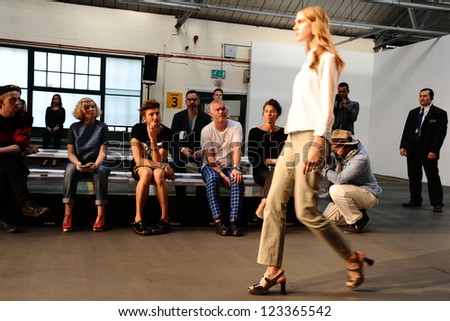 Henry Holland watches models rehearse at the House of Holland catwalk show as part of London Fashion Week SS13, London. 15/09/2012 Picture by: Steve Vas
