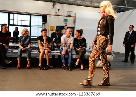 Henry Holland watches models rehearse at the House of Holland catwalk show as part of London Fashion Week SS13, London. 15/09/2012 Picture by: Steve Vas