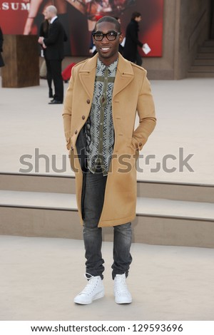 Tinie Tempah arriving for the Burberry Prorsum catwalk show as part of London Fashion Week AW13, Kensington Gardens, London. 18/02/2013 Picture by: Steve Vas
