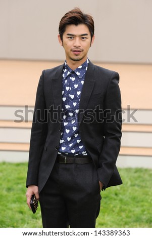 Bolin Chen arriving for the Burberry Prorsum Menswear show as part of London Collection Men SS14, Perks Field, Kensington, London. 18/06/2013