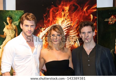 Liam Hemsworth, Jennifer Lawrence and Sam Claflin at the 66th Cannes Film Festival - The Hunger Games: Catching Fire - photocall. 18/05/2013