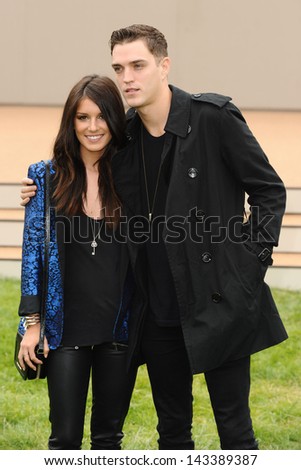 Shenae Grimes and Josh Beech arriving for the Burberry Prorsum Menswear show as part of London Collection Men SS14, Perks Field, Kensington, London. 18/06/2013