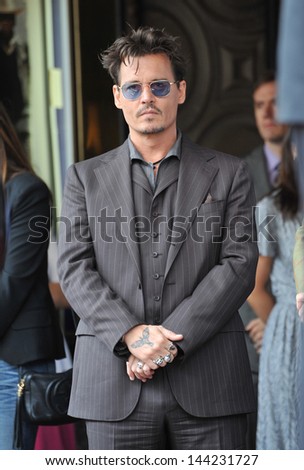 Johnny Depp on Hollywood Boulevard where Jerry Bruckheimer was honored with the 2,501st star on the Hollywood Walk of Fame. June 24, 2013  Los Angeles, CA