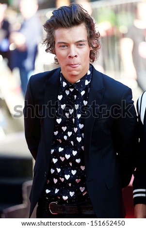 One Direction, Harry Styles arriving for the One Direction This is Us World film premiere, London. 20/08/2013