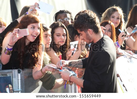 Zayn Malik from One Direction arriving at the UK Premiere of \'One Direction, This Is Us\' at the Empire Leicester Square, London. 20/08/2013