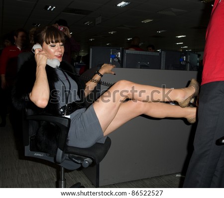 Tara Palmer Tompkinson takes to the trading floor at BGC in Canary Wharf as part of the fundraising day set up after the 9/11 terrorist attacks. 12/09/2011 Picture by: Simon Burchell / Featureflash