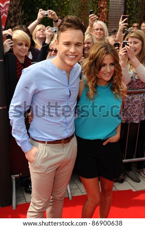 new X Factor Extra presenters, Olly Murs and Caroline Flack arrive for the first auditions of the new series of X Factor at the LG Stadium, Birmingham. 01/06/2011  Picture by: Steve Vas / Featureflash
