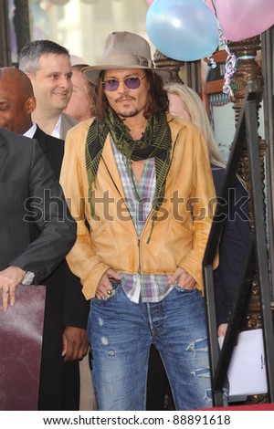 Johnny Depp on Hollywood Boulevard where actress Penelope Cruz was honored with the 2,436th star on the Hollywood Walk of Fame. April 1, 2011  Los Angeles, CA Picture: Paul Smith / Featureflash