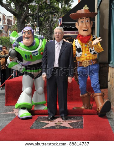 Composer Randy Newman with Toy Story 3 stars Buzz Lightyear and Woody was honored today with a star on the Hollywood Walk of Fame. June 2, 2010  Los Angeles, CA Picture: Paul Smith / Featureflash