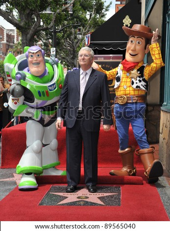 Composer Randy Newman with Toy Story 3 stars Buzz Lightyear and Woody was honored today with a star on the Hollywood Walk of Fame. June 2, 2010  Los Angeles, CA Picture: Paul Smith / Featureflash