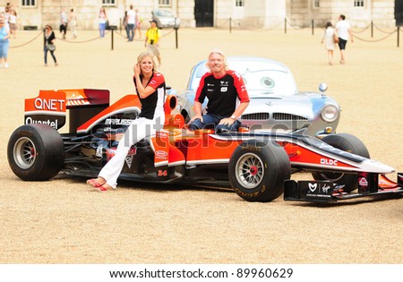 Richard and Holly Branson at a photocall to promote the new Disney Pixar Film Cars 2 with Marussia Virgin Racing. Horse Guards Parade London  04/07/2011 Picture by: Simon Burchell / Featureflash