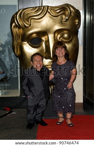 Warwick Davis and wife arriving for the BAFTA Children\'s Awards 2011 at the Hilton Park Lane, London. 27/11/2011 Picture by: Simon Burchell / Featureflash