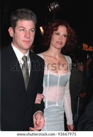 20NOV97:  Actress SIGOURNEY WEAVER & husband JIM SIMPSON at the premiere of her new movie, \