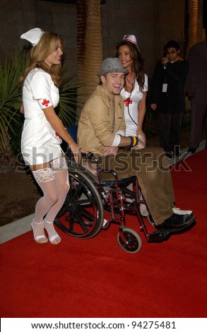 JUSTIN TIMBERLAKE of \'NSync - with nurses to help him due to his broken foot - at the 2002 Billboard Music Awards at the MGM Grand, Las Vegas. 09DEC2002