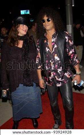 Singer SLASH, of Guns and Roses, & date at opening night party for Rolling Stone Ronnie Wood's art exhibition, in west Hollywood. 01NOV2002.   Paul Smith / Featureflash