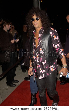 Singer SLASH, of Guns and Roses, & date at opening night party for Rolling Stone Ronnie Wood\'s art exhibition, in west Hollywood. 01NOV2002.   Paul Smith / Featureflash