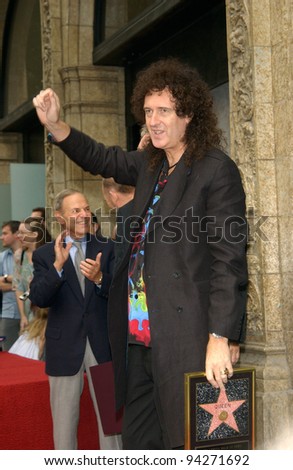 QUEEN star BRIAN MAY on Hollywood Boulevard where the rock group was honored with the 2,207th star on the Hollywood Walk of Fame. 18OCT2002.   Paul Smith / Featureflash