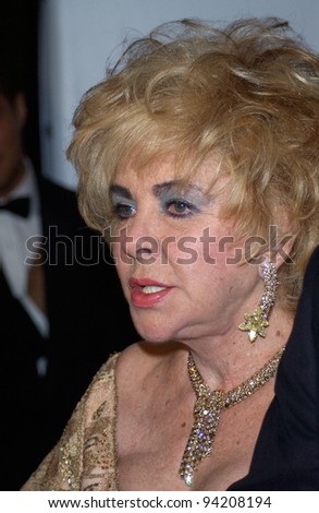 Actress DAME ELIZABETH TAYLOR arriving at the amfAR Cinema Against AIDS Gala at the Moulin de Mougins restaurant just outside Cannes. 23MAY2002.  Paul Smith / Featureflash