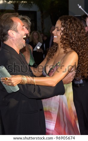 Actress HALLE BERRY & director PITOF at the world premiere, in Hollywood, of their new movie Catwoman. July 19, 2004