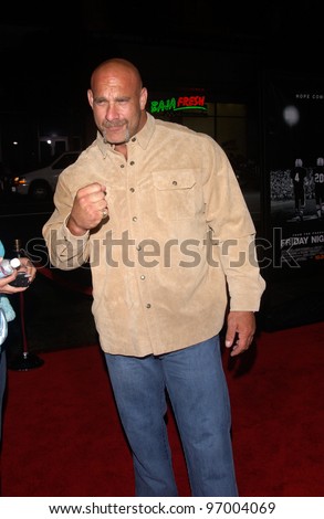 Actor/wrestler BILL GOLDBERG & date at the world premiere, in Hollywood, of Friday Night Lights. October 6, 2004